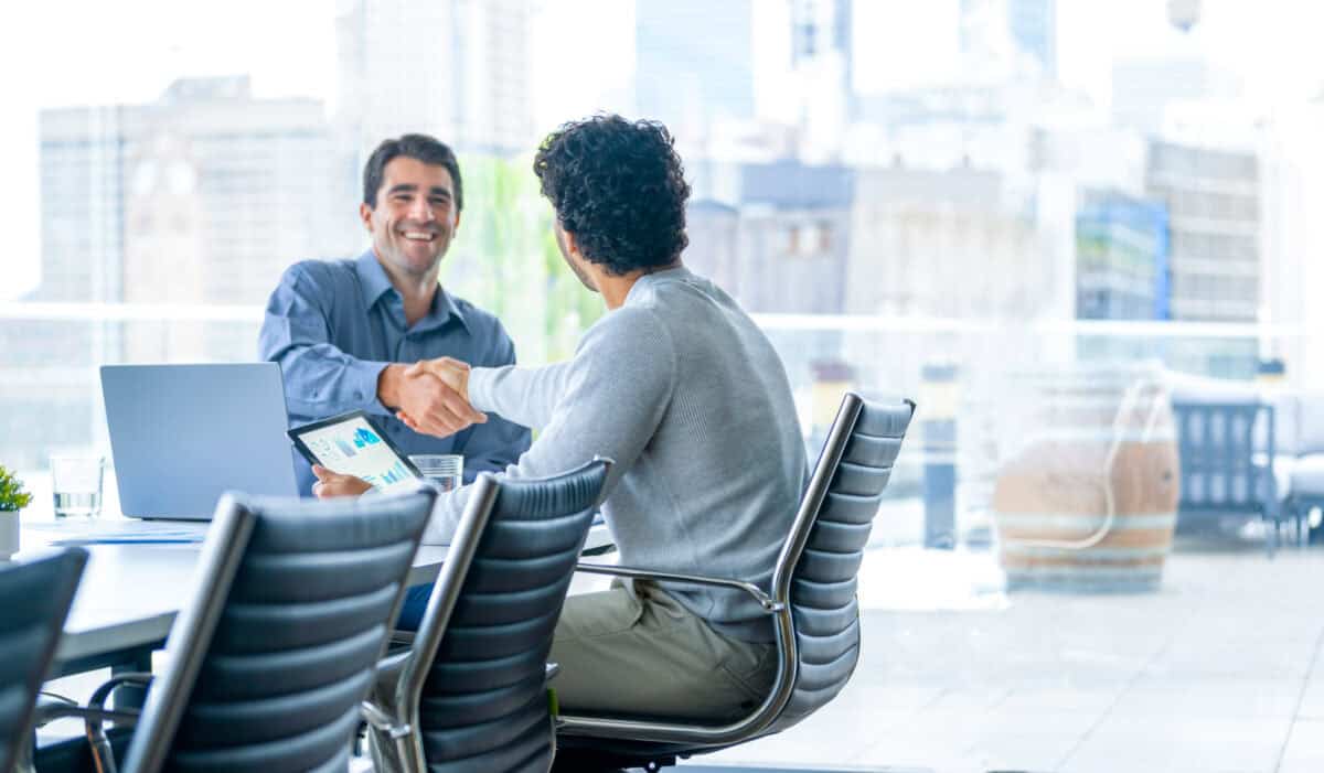businessmen shake hands to close a deal