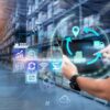 Person uses a tablet in a blurred warehouse as background