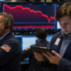 Traders looking at falling stock market wall street