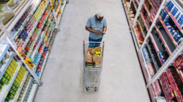 man shops at grocery store